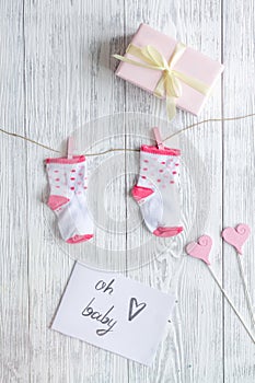 Birth of girl - baby shower concept on wooden background