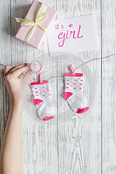Birth of girl - baby shower concept on wooden background