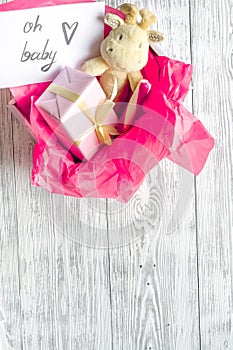 Birth of girl - baby shower concept on wooden background