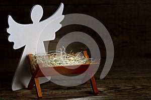 The birth of Jesus Christ abstract christmas nativity scene with manger and angel