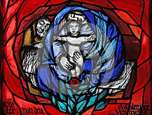 Birth of Jesus, Christmas, detail of stained glass window in St. James church in Hohenberg, Germany