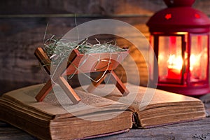 Birth of Jesus with manger on the bible photo