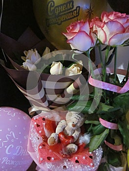 Birthda A bouquet of flowers and balloons for a birthday, anniversary or other holiday y bouquet and balloons