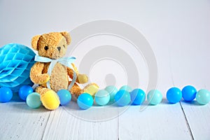 Birthday boy background with teddy bear , blue small balls and honeycomb ball , party decoration