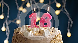 Birthday cake with 16 number pink candle on blue backgraund
