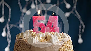 Birthday cake with 54 number pink candle on blue backgraund