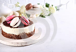 birthday cake with berries and macarons