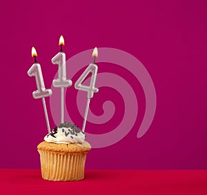 Birthday cake with candle number 114 - Rhodamine Red foamy background