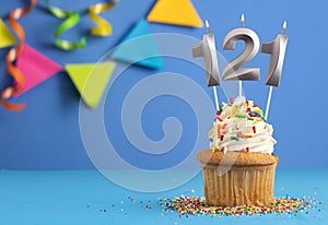 Birthday cake with candle number 121 - Blue background