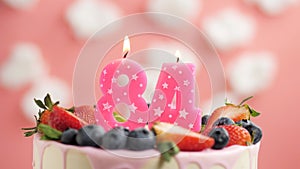Birthday cake candle number 84. Candle and cake on pink background and fire by lighter. Close-up and slow motion