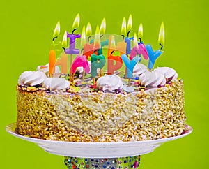 Birthday cake with colorful happy birthday candles