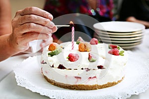 Birthday cake lighting a candle, celebration