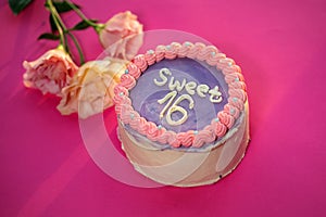 Birthday cake with number 6 on pink background