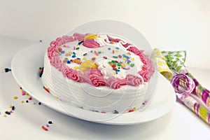Birthday Cake and Party Blowers photo
