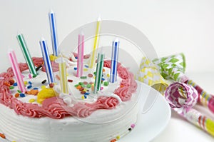 Birthday Cake and Party Blowers photo
