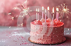 Birthday Cake With Pink Frosting and Sparklers