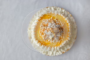 Birthday cake with whipped cream and biscuits