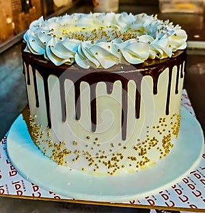 birthday cake white  cream yummy chocolate round flower and blue decoration beautiful photo image