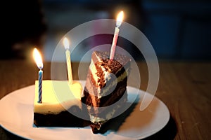 Birthday cakes distributed in a plate with candles photo