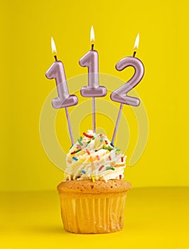 Birthday candle number 112 - Invitation card with yellow background