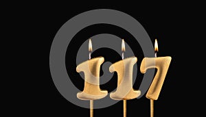 Birthday candle number 117 - Birthday celebration on black background