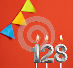 Birthday candle number 128 - Invitation card in orange background