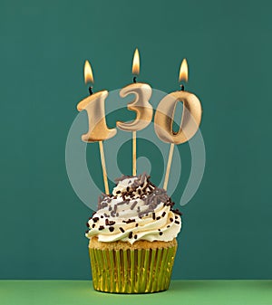 Birthday candle number 130 - Vertical anniversary card with green background