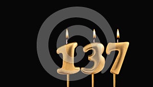 Birthday candle number 137 - Birthday celebration on black background