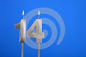 Birthday candle number 14 - Celebration card on blue background
