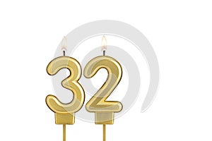 Birthday candle number 32 on white background