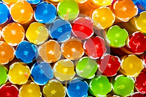 birthday candles, thin brightly colored candles used to mark the years celebrated on the cake.