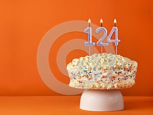 Birthday card with candle number 124 - Vanilla cake in orange background