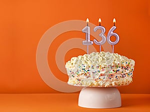 Birthday card with candle number 136 - Vanilla cake in orange background