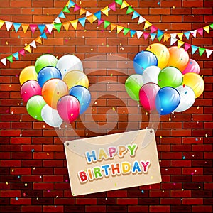 Birthday card and flying balloons on brick wall background