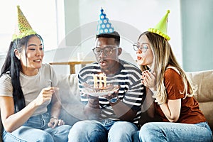 birthday celebration party cake happy candle blowing friendship fun friend woman home smiling lifestyle happy man