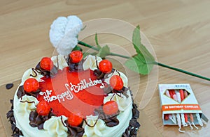 Birthday chocolate cake with strawberry jam.
