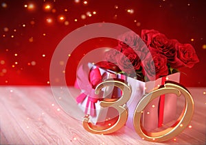Birthday concept with red roses in the gift on wooden desk. 30th. 3D render