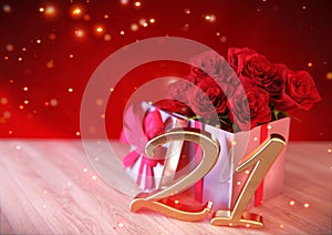 Birthday concept with red roses in the gift on wooden desk. twenty-first. 21st. 3D render