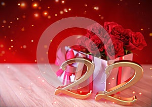 Birthday concept with red roses in the gift on wooden desk. twenty-second. 22nd. 3D render