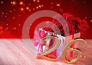 Birthday concept with red roses in the gift on wooden desk. twenty-sixth. 26th. 3D render photo