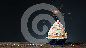 Birthday Cupcake American style. Sparkler light burning in a cake. 4th of July, Independence, Memorial or Presidents Day. Tasty cu