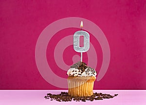 Birthday cupcake with candle number 0 - Birthday card on pink background