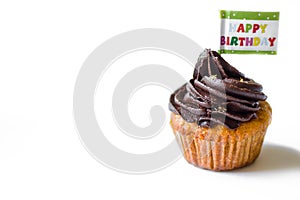 Birthday cupcake with the chocolate frosting on the top isolated