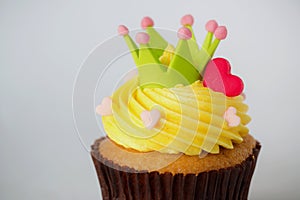 Birthday cupcake in front of a white background Cupcake with yellow cream