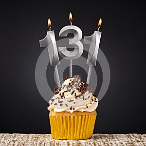 birthday cupcake with number 131 candle - Celebration on dark background