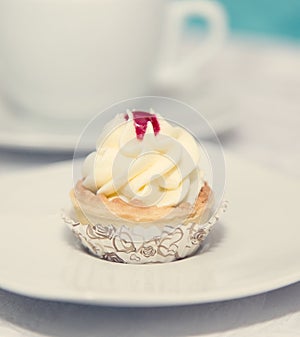 Birthday cupcake on plate. Selective focus.