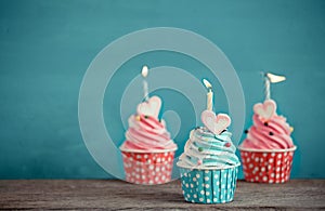 Birthday cupcake with sweet heart shape of marshmallow