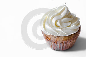 Birthday cupcake with the white chocolate frosting on the top isolated