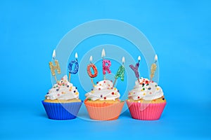 Birthday Cupcakes With Candles That Say Hooray photo