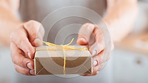 Birthday gift man giving present wrapped paper